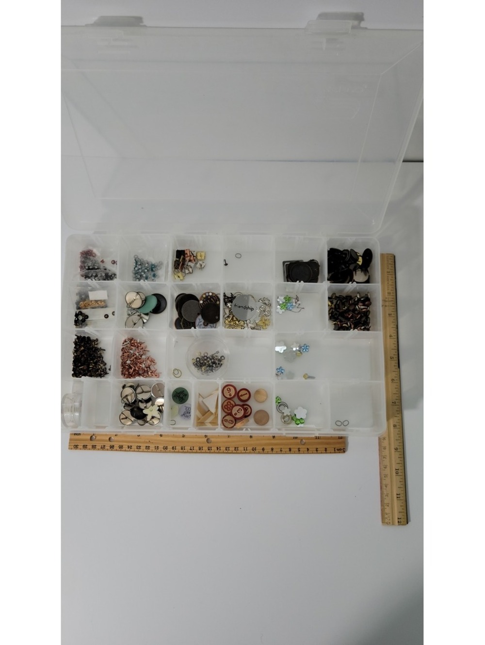 Brads and craft supplies comes with plastic storage case